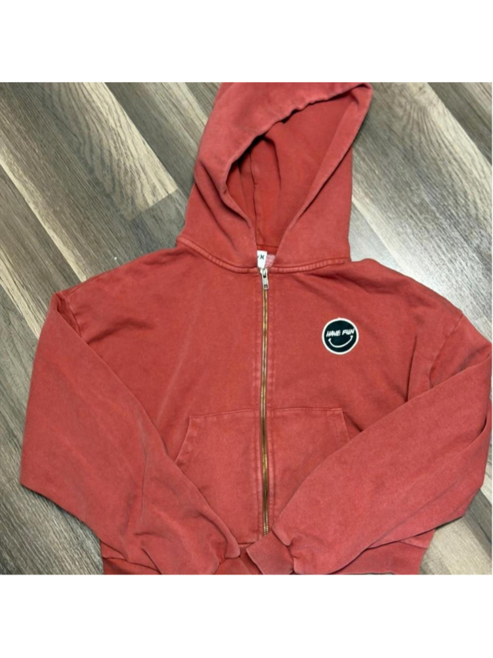 Hurley washed rust zip-up hoodie with a faded worn-in finish and “Have Fun” smil